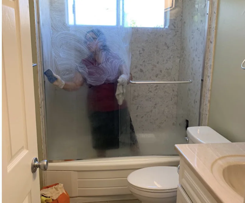 Espino cleaning work in a bathroom shower