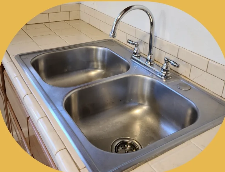 Close view of a clean stainless-steel kitchen sink